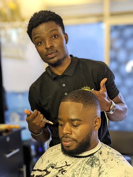 Barber giving a fresh fade
